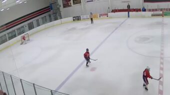 Setting up in front of the net and burying the pass for a goal! Image