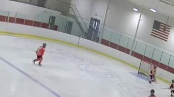 Gaining puck possession, curling and making a tape to tape pass for an assist on the goal! Image